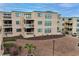 Condo exterior showcasing the balconies, green roof trim, parking lot and landscaping at 9661 Shore Dr. # A-21, Myrtle Beach, SC 29572