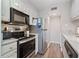 Well-equipped kitchen with stainless steel appliances and white cabinetry at 9661 Shore Dr. # A-21, Myrtle Beach, SC 29572