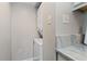 Convenient laundry area with stacked washer and dryer, next to countertop and storage at 9661 Shore Dr. # A-21, Myrtle Beach, SC 29572