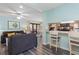 Open living room area with bar, chairs, and ocean decor at 9661 Shore Dr. # A-21, Myrtle Beach, SC 29572