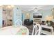 Inviting living room featuring coastal decor, a cozy seating area, and a dining space at 9661 Shore Dr. # A-21, Myrtle Beach, SC 29572