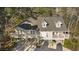 Beautiful aerial view showcasing the stilt home's layout, gray roof, and surrounding landscape at 98 Wallys Way # 1, Pawleys Island, SC 29585