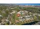 Aerial view of a coastal community with homes, pools, and lush landscaping near the ocean at 98 Wallys Way # 1, Pawleys Island, SC 29585