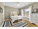 Bright bedroom with light-colored walls, wood floors, and beach-themed decor at 98 Wallys Way # 1, Pawleys Island, SC 29585