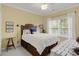 Comfortable bedroom with natural light, white bedding, and under-bed storage at 98 Wallys Way # 1, Pawleys Island, SC 29585