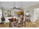 Open concept dining room and kitchen area with hardwood flooring at 98 Wallys Way # 1, Pawleys Island, SC 29585