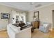 Cozy living room with a sailboat decoration in the window and comfortable seating arrangement at 98 Wallys Way # 1, Pawleys Island, SC 29585