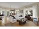 Bright living room connected to dining area with comfortable seating and nautical-themed decor at 98 Wallys Way # 1, Pawleys Island, SC 29585