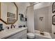 Cozy bathroom featuring a modern vanity, framed mirror, and a bathtub with stylish tile surround at 1006 James Island Ave., North Myrtle Beach, SC 29582