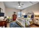 Comfortable bedroom with a ceiling fan, a dresser, and a large bed with decorative pillows at 1006 James Island Ave., North Myrtle Beach, SC 29582