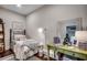 Bright bedroom with hardwood floors, a desk, and a comfortable bed at 1006 James Island Ave., North Myrtle Beach, SC 29582