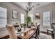Elegant dining room with wainscoting, plantation shutters, and a wooden table set for a meal at 1006 James Island Ave., North Myrtle Beach, SC 29582