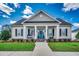 Charming single-story home featuring a welcoming front porch, blue front door, and manicured lawn at 1006 James Island Ave., North Myrtle Beach, SC 29582