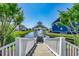 Picturesque view of a community gazebo overlooking the lake, surrounded by lush landscaping at 1006 James Island Ave., North Myrtle Beach, SC 29582