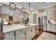 Kitchen open to the living space, featuring a large island with modern fixtures and stainless steel appliances at 1006 James Island Ave., North Myrtle Beach, SC 29582