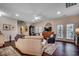 Spacious living room with a ceiling fan, comfortable seating, and access to an outdoor space at 1006 James Island Ave., North Myrtle Beach, SC 29582