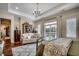 Spacious bedroom featuring a seating area, large windows with water views, and a cozy atmosphere at 1006 James Island Ave., North Myrtle Beach, SC 29582