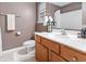 Cozy bathroom featuring a wooden vanity and shower with white tiling for a clean, modern look at 1024 Stanton Pl. # 1024, Myrtle Beach, SC 29579