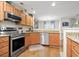View of the kitchen featuring stainless steel appliances and warm wood cabinetry at 1024 Stanton Pl. # 1024, Myrtle Beach, SC 29579