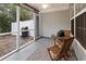 Inviting screened porch featuring a cozy seating area, ideal for relaxing outdoors at 1024 Stanton Pl. # 1024, Myrtle Beach, SC 29579