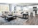 Inviting living room featuring hardwood floors, a comfortable sofa, and an open connection to the kitchen at 1174 Oak Meadow Dr., Conway, SC 29526