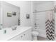 Clean bathroom features a single vanity and a shower-tub combo with a patterned shower curtain at 1119 Maxwell Dr., Little River, SC 29566