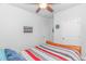 Cozy bedroom with a striped bedspread and neutral walls at 1119 Maxwell Dr., Little River, SC 29566