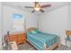 Bedroom featuring a wood-frame bed, ceiling fan, and a dresser at 1119 Maxwell Dr., Little River, SC 29566