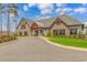 Beautiful community clubhouse featuring stone and siding exterior, complemented by lush landscaping and inviting entrance at 1119 Maxwell Dr., Little River, SC 29566