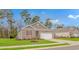 Well-maintained single-story home with brick facade, red shutters, and a manicured front lawn at 1119 Maxwell Dr., Little River, SC 29566
