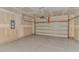 Spacious two-car garage with epoxy flooring and an insulated garage door at 1119 Maxwell Dr., Little River, SC 29566
