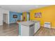 Open-concept kitchen with granite island, stainless steel appliances, and modern white cabinetry at 1119 Maxwell Dr., Little River, SC 29566