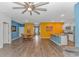 Spacious open-concept living space with modern decor, wood flooring, and bright, colorful walls at 1119 Maxwell Dr., Little River, SC 29566