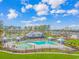 Aerial view of a stunning community pool area, featuring multiple pools, cabanas, and well-manicured lawns at 1119 Maxwell Dr., Little River, SC 29566