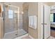 Modern bathroom featuring a glass-enclosed shower with tile surround and neutral color palette at 1186 Pyxie Moss Dr., Little River, SC 29566