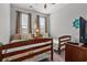 Cozy bedroom with two twin beds, bright windows, and nautical decor details at 1186 Pyxie Moss Dr., Little River, SC 29566