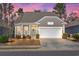 Charming single Gathering home featuring a two-car garage and a well-manicured lawn at 1186 Pyxie Moss Dr., Little River, SC 29566