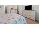Well lit main bedroom featuring marine themed decor, carpeted floors, and wooden furniture at 1186 Pyxie Moss Dr., Little River, SC 29566