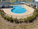 A community pool with brick pavers and manicured bushes at 1186 Pyxie Moss Dr., Little River, SC 29566