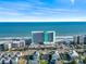 Gorgeous aerial shot of beachfront resort with stunning ocean views, nearby parking, and neighborhood charm at 1210 N Waccamaw Dr. # 1507, Murrells Inlet, SC 29576