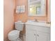 Bathroom with toilet, vanity, mirror, and tile floor offers functionality in a compact space at 1210 N Waccamaw Dr. # 1507, Murrells Inlet, SC 29576