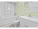 A bathroom with a shower-tub combo, toilet, and sink with white vanity at 1210 N Waccamaw Dr. # 1507, Murrells Inlet, SC 29576