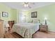 Bright bedroom with a queen-size bed, ceiling fan, and ample closet space at 1210 N Waccamaw Dr. # 1507, Murrells Inlet, SC 29576