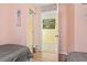 Comfortable bedroom with two twin beds and open doorway leading to the bathroom at 1210 N Waccamaw Dr. # 1507, Murrells Inlet, SC 29576