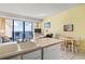 Open floor plan with a kitchen overlooking the dining and living area with ocean view at 1210 N Waccamaw Dr. # 1507, Murrells Inlet, SC 29576