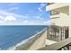 Elevated view of the ocean from the balcony showcases the expansive coastline at 1210 N Waccamaw Dr. # 1507, Murrells Inlet, SC 29576