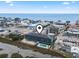 Drone shot highlighting coastal community and ocean access at 123 N Dogwood St. # 107, Garden City Beach, SC 29576