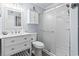 Bathroom features a white vanity with modern fixtures and a glass-enclosed shower at 123 N Dogwood St. # 107, Garden City Beach, SC 29576