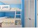 Bedroom with a bunk bed and a white closet door provides a comfortable living space at 123 N Dogwood St. # 107, Garden City Beach, SC 29576