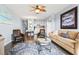 Open-concept living room and kitchen with hardwood floors and beach-themed decor at 123 N Dogwood St. # 107, Garden City Beach, SC 29576